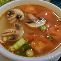 Tom Yum · Spicy, Lemongrass, kaffir lime, mushrooms, and tomatoes in a spicy chili broth.