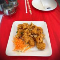 Spicy Calamari · Spicy. Fried lightly battered squid tossed with hot chili, onions, and garlic.