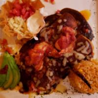 Lobster Enchiladas · 2 cheese enchiladas, sauteed with onions and red bell pepper, covered with our mole sauce, s...