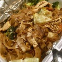 Pad See Ew · Stir-fried flat rice noodle with eggs, broccoli, cabbage and carrots in special brown sauce.
