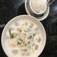 Tom Kha Gai Soup · Creamy coconut milk soup with chicken, yellow and green onions, galangal, mushrooms, lemongr...