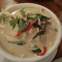Green Curry · Tasty green curry with coconut milk, bamboo shoots, red bell peppers, jalapeno and basil.