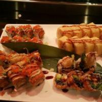 Red Blossom Roll · Shrimp tempura, spicy kani inside, with spicy tuna, masago, scallion, eel sauce and wasabi m...