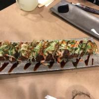 Florida Crunch Roll · Tempura roll with crab, salmon and deep fry salmon skin (chicharron), cream cheese topped wi...