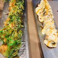 Hello Sushi Roll · Crispy salmon, crab salad, topped with smoked salmon and sweet plantain, melted raclette che...