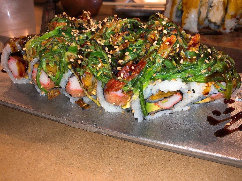 Havana 305 Roll · Smoked salmon, crab, sweet plantain and avocado, topped with mixed crispy crab and wakame (seaweed salad).