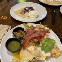Frenchero Crepe · Cheddar cheese, grilled peppers, onions, avocado, bacon, and 2 over easy eggs topped with sa...