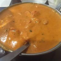 Butter Chicken · Gluten-free. Chicken pieces simmered in a sauce made with butter, cream, yogurt, and spices.