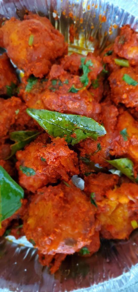 Gobi 65 · Cauliflower deep-fried and coated with garlic, red chili peppers and curry leaves.