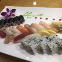 Sushi Deluxe · 9pcs of chef’s  choice nigiri & 1 tuna roll and  1 California roll
