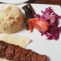 Adana Kebab · Hand chopped lamb seasoned with red bell pepper.
