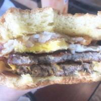 Ultimate Breakfast Burger Sandwich · Cheeseburger served on a burger bun topped with fried eggs, hash brown and bacon or ham.