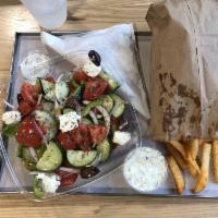 Greek Salad · Vine ripened tomatoes, red onions, green peppers, cucumbers and Kalamata olives. Tossed ligh...
