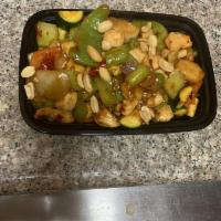 Kung Pao Chicken · Sauteed chicken breast with peanuts, scallion, and jalapeño in a spicy brown sauce. Spicy.