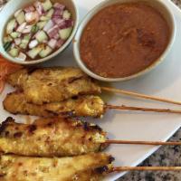 Satay · (4) sticks of char-grilled marinated skewered meat served with peanut sauce.