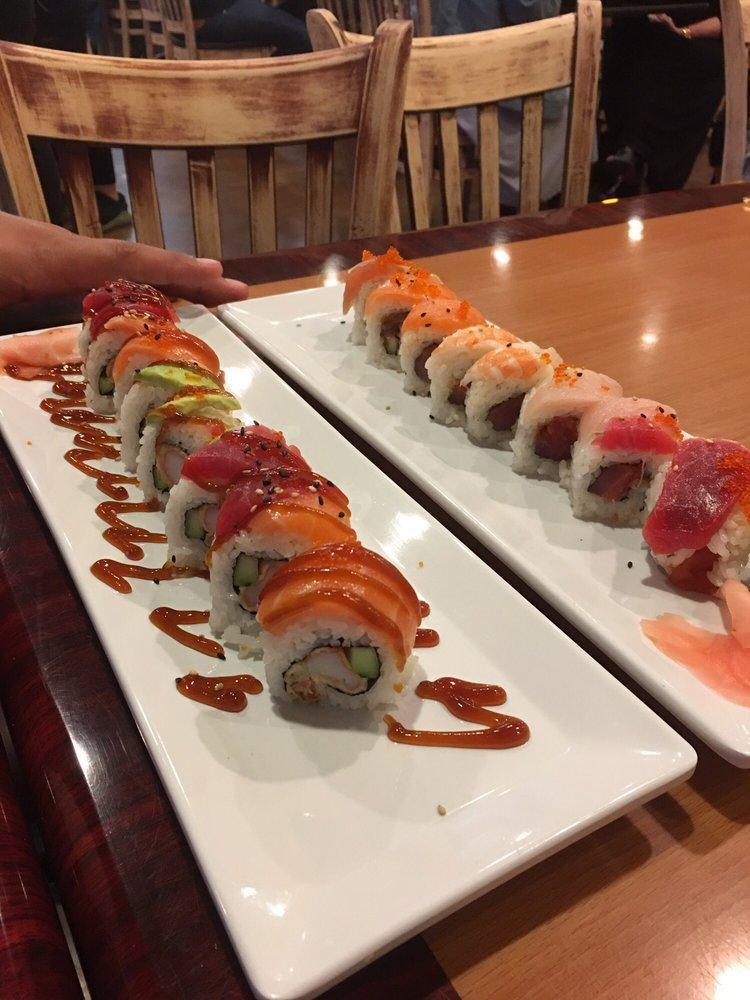 Rainbow Roll · Inside: crab, avocado, cucumber. Top: assorted sashimi and tobiko.