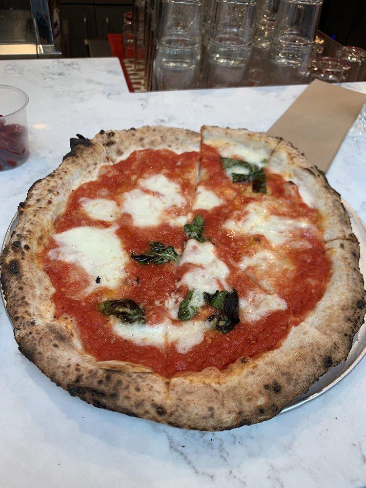 Margherita Pizza · San Marzano tomatoes, fresh Buffalo mozzarella, pecorino Romano, basil and extra virgin olive oil. Vegetarian.