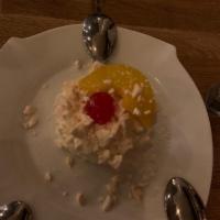 Dj Gio's Favorite Postre Chaja · Vanilla sponge cake layers with dulce de leche, peaches, whipped cream and crumbled meringue.