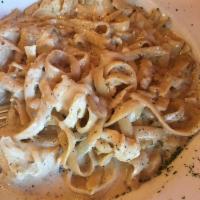 Fettuccine Alfredo · Garlic toasted with cream and cheese.