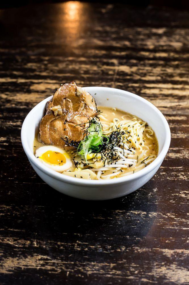 Miso Ramen · Rich miso soup filled with roasted sweet corn, scallion, bean, sprout, nori seaweed half hard boil egg and bamboo shoot topped with thick slab of chashu pork.