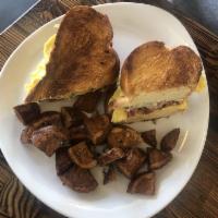 Breakfast Smash · Two Scrambled Eggs, White Cheddar, Smoked Bacon, Garlic Aioli on Buttered Challah Toast with...