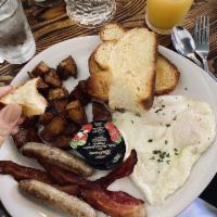 Countryman Breakfast · Two Eggs Any Style, Applewood Smoked Bacon, Herb & Maple Pork Sausage, Garlic Potatoes, Choi...