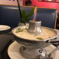 Tom Kha · Coconut soup. Creamy Thai coconut soup with chicken, galangal, mushrooms, onions, cilantro, ...