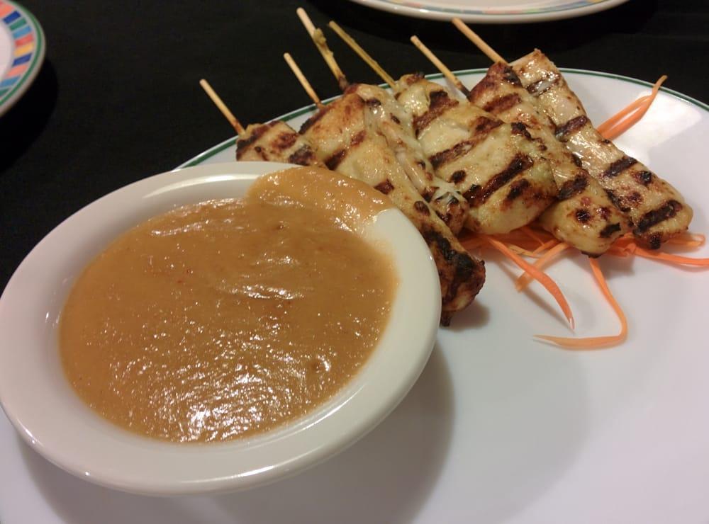 Chicken Satay · Marinated in a blend of Thai herbs and coconut milk. Skewered and grilled. Served with peanut sauce.