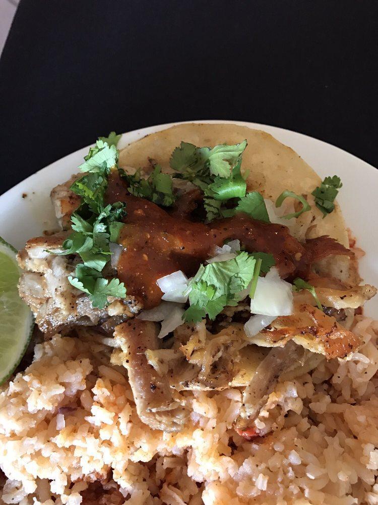 Braised Pork Belly Taco · White marble farms raised pork slow braised, seared and tucked into warm corn tortillas and topped with cilantro, onions, and our house made lino's hot sauce.