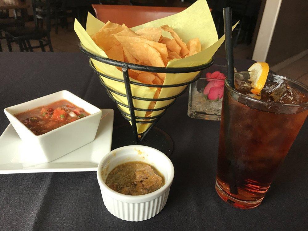Chile Verde · Chunks of tender pork meat, simmered in a tomatillo, jalapeno sauce. Served with rice and beans.