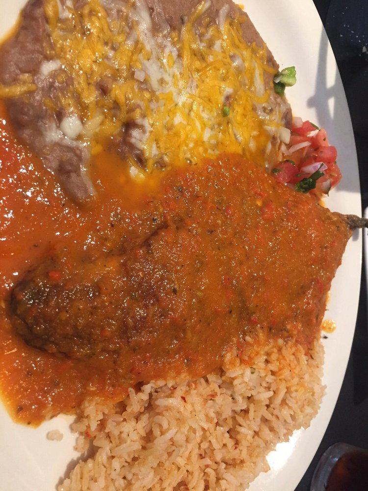 Chile Relleno · Fresh Anaheim Chile roasted and filled with melted Monterey Jack cheese, battered and cooked golden brown. Topped with house made Relleno sauce. Served with rice and beans.