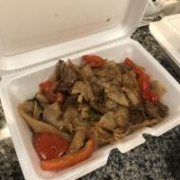 Dinner Drunken Noodles · Stir fried fresh wide rice noodles with hot pepper, tomato and onion in a spicy basil sauce....