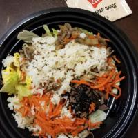 Bibimbap · White rice, quinoa, assorted seasonal vegetables and egg with Bonchon red pepper paste on th...