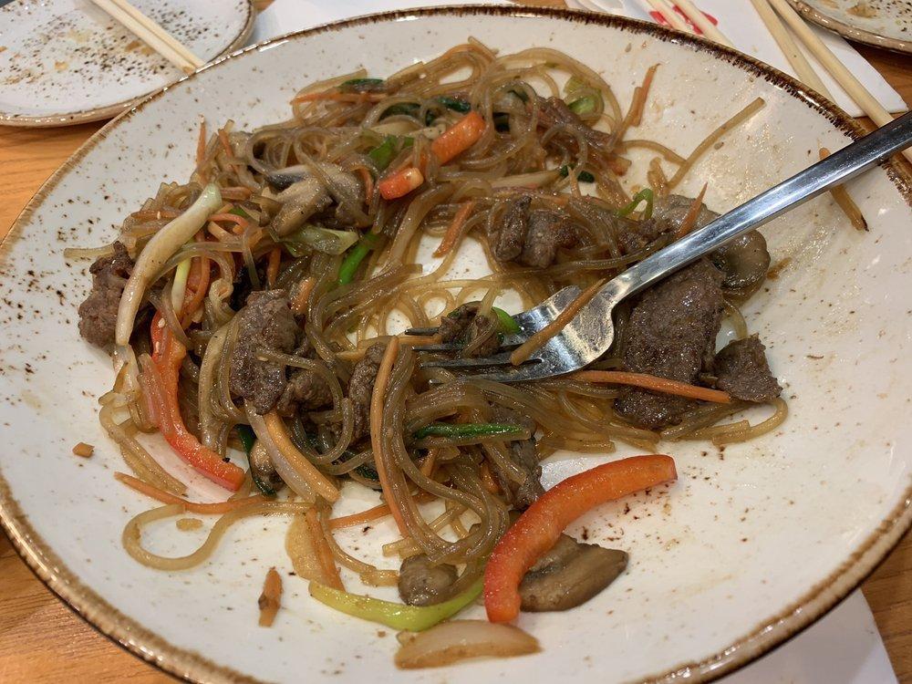 Japchae · Glass noodles, red pepper, carrots, onions, spinach, mushrooms and thinly sliced marinated beef stir-fried with Bonchon soy garlic sauce and sesame oil.