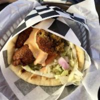 Falafel Gyro · Chickpea patties deep fried to golden perfection. Served in a warm pita with lettuce, tomato...