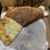 The White Pizza · Garlic oil base, mozzarella, ricotta, parm, and garlic