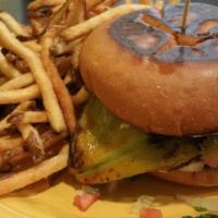 Green Chili Burger · Topped with roasted poblano pepper and melted cheese, comes with lettuce, tomato and chipotl...