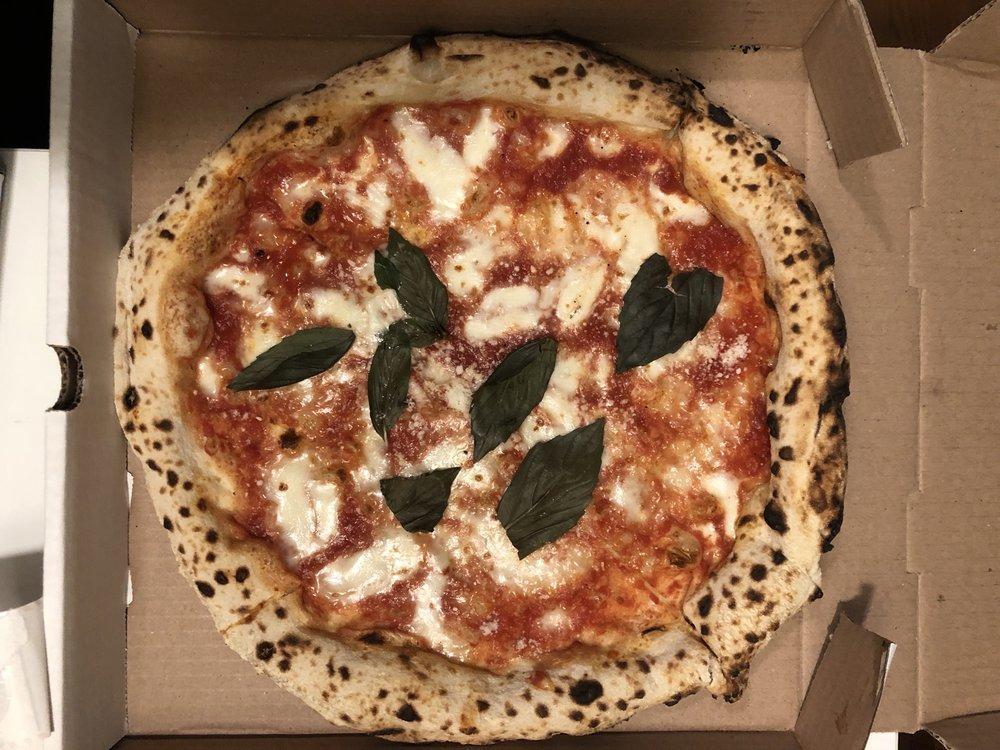Margherita Pizza · Tomato, basil, parm and mozzarella.