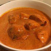 Butter Chicken · Chicken cooked with bold spices and gentle flavors in a delicate combination of tomatoes, cr...