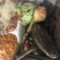 Carne Asada Plate · Grilled Carne Asada served with rice and beans. Choice of tortillas.