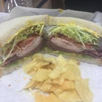 Godfather Sandwich · Turkey, roast beef, bacon, avocado, provolone, lettuce, tomato, mayo, and mustard.