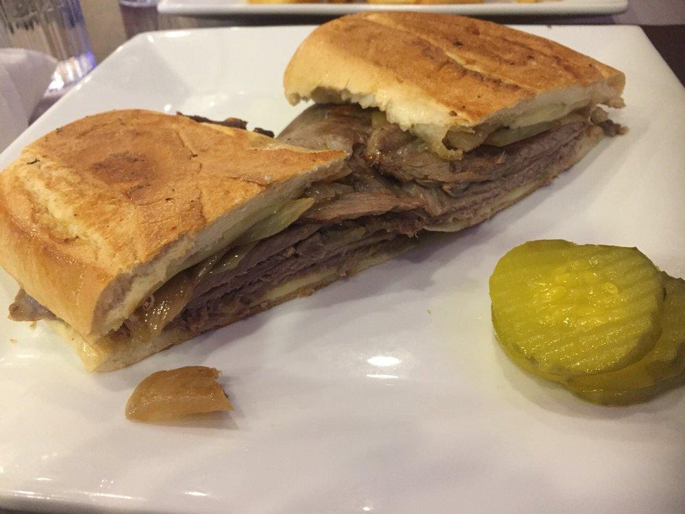 Slow Cooked Prime Rib Panini · Prime rib, grilled caramelized onions, Swiss cheese and horseradish sauce. Served with choice of side.