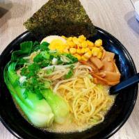 Miso Hungry Ramen · Veggie broth. Topped with baby bok choy, bamboo shoot, shredded cabbage, half pickled egg, b...