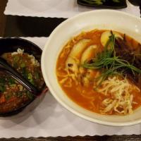 Spicy Tonkotsu · Spicy pork broth with noodles topped with black mushrooms, bean sprouts green onions, 1/2 so...