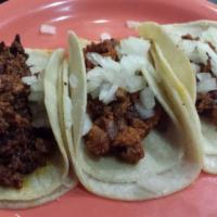 Pastor Taco · Marinated pork. Served with cilantro and onion.  Anything else added to this is an extra cha...
