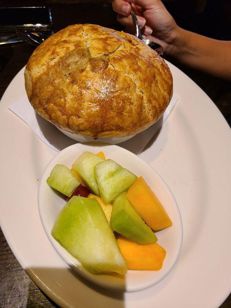 Chicken Pot Pie · CJ classic since 1977, baked fresh throughout the day. Carrots, onions, mushrooms, peas, simmered slowly in savory herb cream sauce, Claim Jumper’s flaky pie crust, fresh fruit.