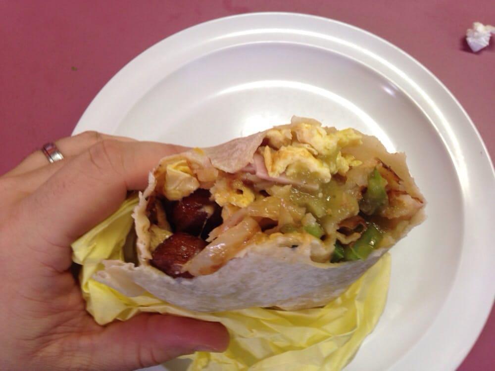 Super Breakfast Burrito · Hash browns, two eggs, cheese, bacon, sausage, ham and fajita vegetables (mushrooms, onions and peppers).
