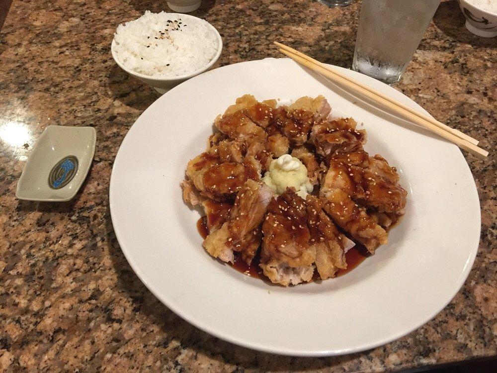 Sesame Chicken · Crispy fried chicken served with teriyaki sauce and sesame seeds.