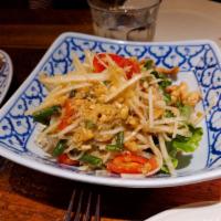 Papaya Salad · Shredded papaya, string beans, tomatoes and peanuts with Thai chili-lime dressing and topped...