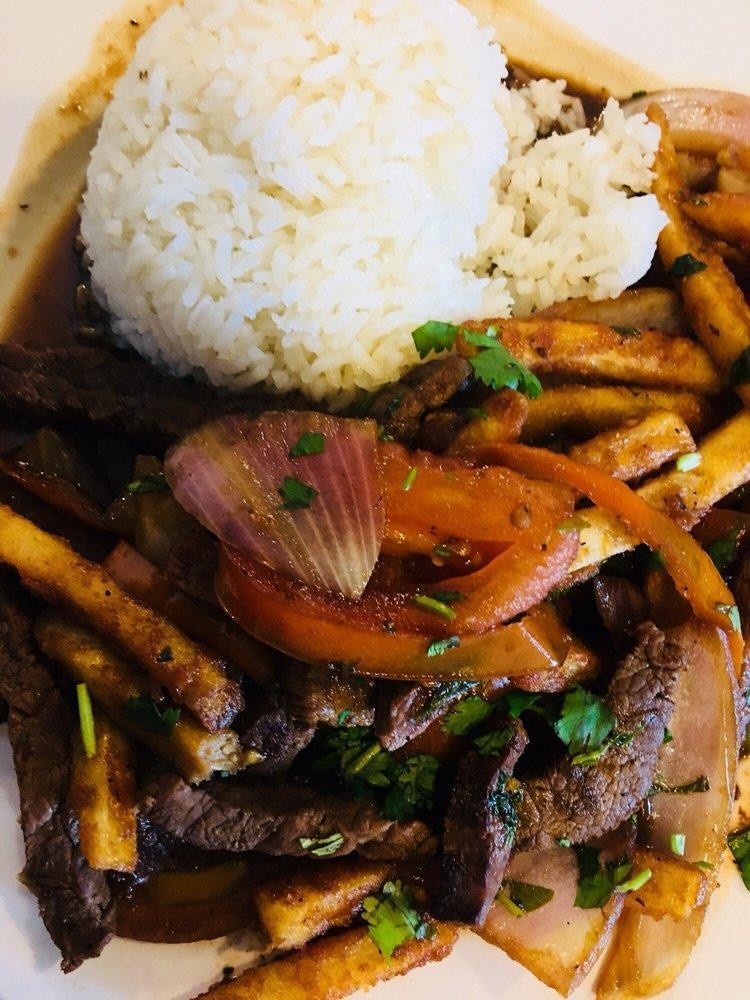 Lomo Saltado · Beef tenderloin strips with sauteed red onions and tomatoes. Served with white rice and french fries.